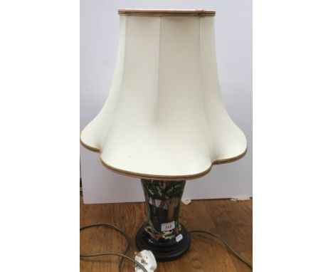 A Moorcroft "Holly tree pattern with caterpillars at base" vase table lamp with tube lined decoration on wooden plinth base b