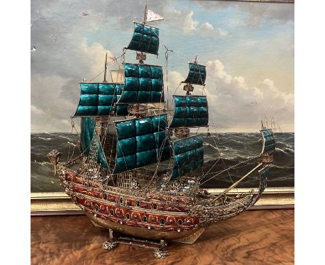 A circa 1900 Austro-Hungarian silver Nef (model galleon) gilt embellished with green enamel sails and and with polychrome ena