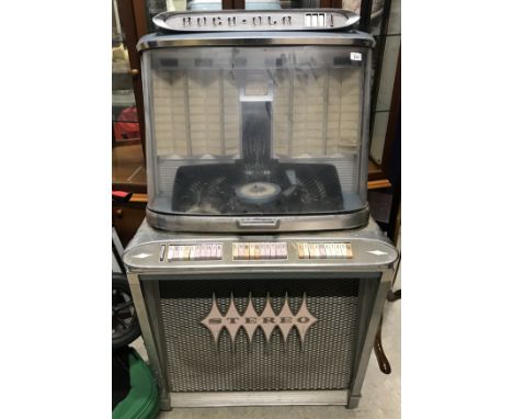 A circa 1961 Rock-ola stereo 1488 "Regis 120" jukebox, chrome based with mechanism for 45 rpm singles, 81.5 cm wide x 69 cm d