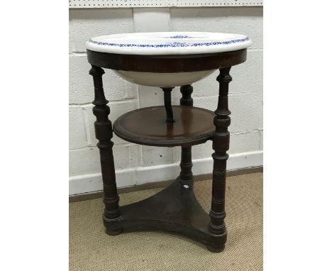 A circa 1900 blue and white transfer decorated basin with soap dishes of circular form raised on a mahogany two tier frame wi