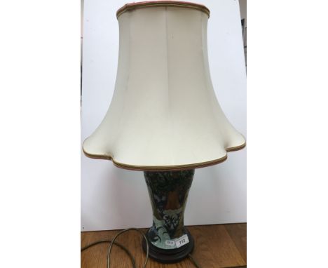 A Moorcroft "Trees in woodland" pattern vase table lamp with tube lined decoration on wooden plinth base bearing "Brights of 