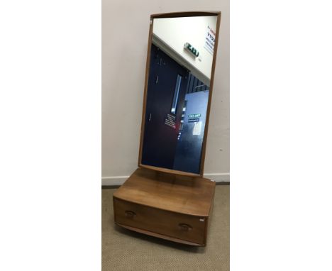 An Ercol elm cheval type dressing mirror, the rectangular plate over a single drawer base on castors, 66 cm wide x 48.5 cm de