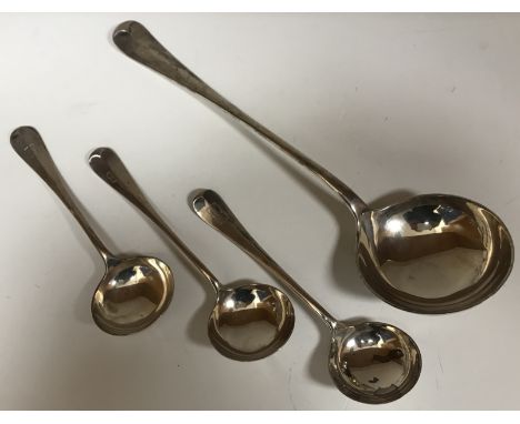 An Edwardian silver Old English pattern Rat Tail design soup ladle (by William Hutton & Sons, London 1909), together with thr