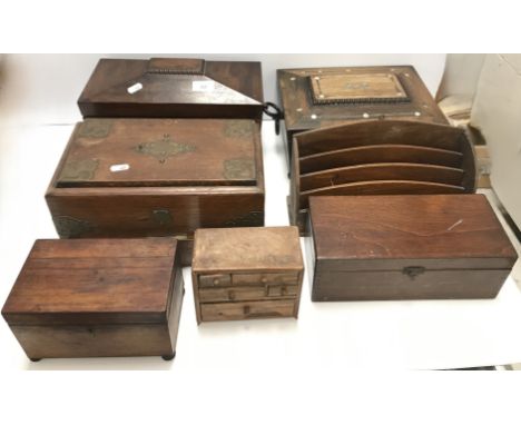 A 19th Century rosewood sarcophagus shaped tea caddy with two canisters flanking a cut glass bowl, 32 cm wide x 16.5 cm deep 