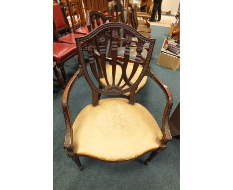 A pair of George I style figured walnut single dining chairs with floral tapestry seats on shell headed cabriole legs and a p