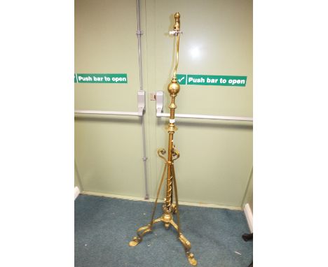 An early 20th century brass telescopic standard lamp on tripod base 165cm high