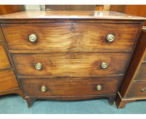 A George III mahogany chest of three long graduated drawers on shaped apron and splay bracket feet, 92cm wide, 53cm deep, 83c