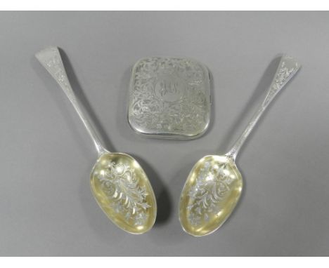 A pair of silver tablespoons with engraved decoration together with a silver cigarette case, hallmarked Birmingham