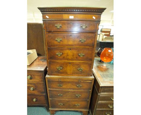 A George III style crossbanded walnut veneered chest on chest of small proportions with four graduated drawers to the upper s