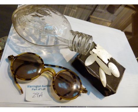 Vintage sunglasses, feeding bottle and mother of pearl tokens