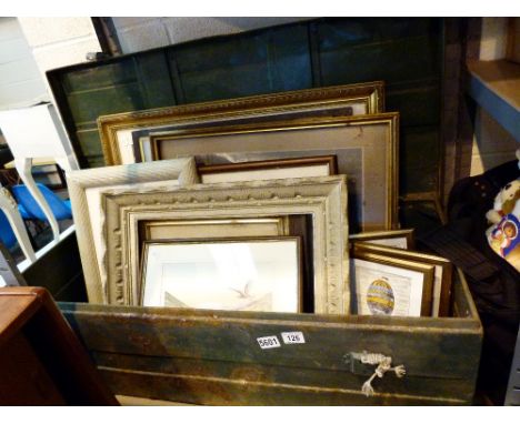 Large metal tool trunk containing a selection of framed prints 