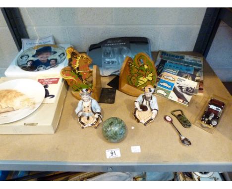 Shelf of collectable items including bookends