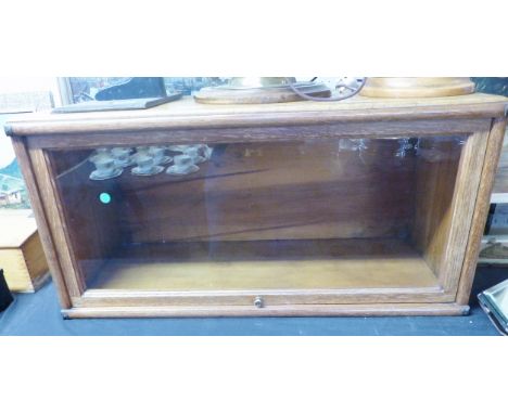 GLAZED DISPLAY UNIT. Light oak glazed counter top display unit, 86 x 43 x 35cm