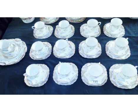 FLORAL AND GILT TEA SERVICE. Forty one pieces of Victoria floral and gilt tea service on white ground, lacking teapot