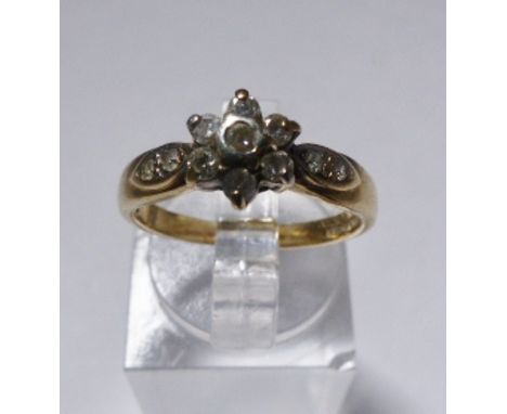 GOLD DIAMOND RING. 9ct gold diamond flower ring, size K/L