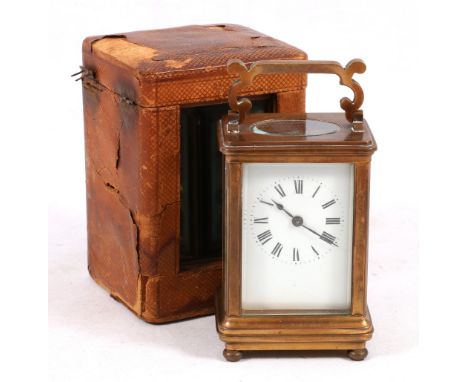 19th century French brass carriage clock, the white enamel dial with Roman numerals chapters in F Cook of London case, 16cm
