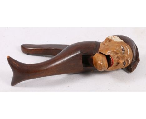 Well carved painted novelty wood nut cracker in the form of a man wearing a hat, early 20th century, 20cm