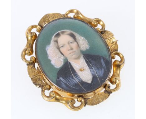 Victorian pinchbeck or gilt metal mourning brooch pendant with portrait miniature (perhaps on ivory) of a lady. 5.5cm