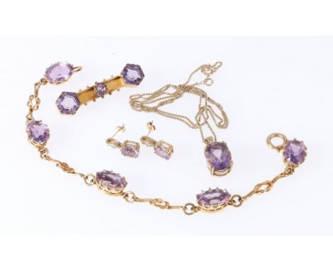 9ct gold mounted faceted amethyst drop pendant on fine 9ct gold chain, 5.2g, a similar yellow metal bracelet set with five fa