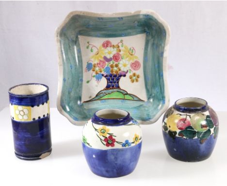 Bough Pottery dish decorated with a vase of flowers and sea green border and three small vases.