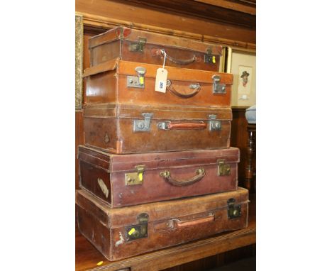 Harlequin set of five vintage leather suitcases.