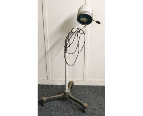 20th century surgical light, with Made in Germany label on base, with original Hanau label, terminating in castors.