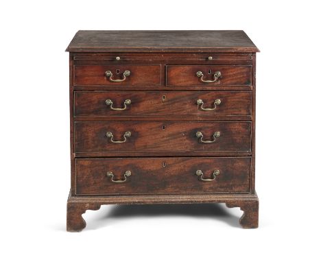 A GEORGE III MAHOGANY CHEST, the plain moulded top above a pull out brushing slide, over two short and three long graduated d