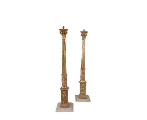 A PAIR OF GILTWOOD CORINTHIAN COLUMN STANDARD LAMPS, 19th century, each fluted tapering column headed with a leafy capitol ov