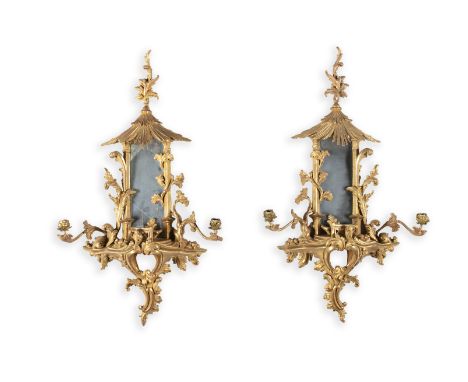 A PAIR OF GEORGE III CARVED GILTWOOD WALL GIRANDOLES, in the Chinoiserie taste, after a design by Thomas Chippendale, in the 