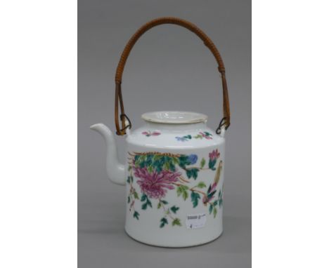 A 19th century Chinese porcelain teapot. 13 cm high excluding handle.