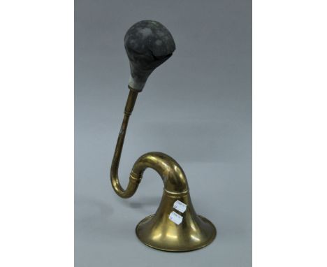 A vintage brass car horn. 39.5 cm long.