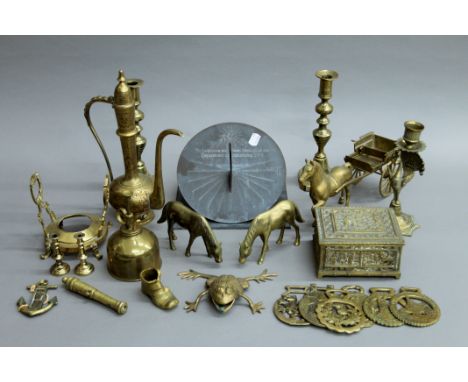 A quantity of brassware and a sundial.