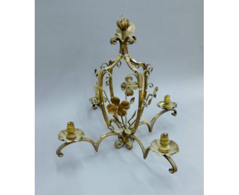 A vintage wrought iron chandelier. 59 cm high.