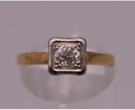 An 18 ct gold diamond solitaire ring. Ring size K/L. 2.4 grammes total weight.