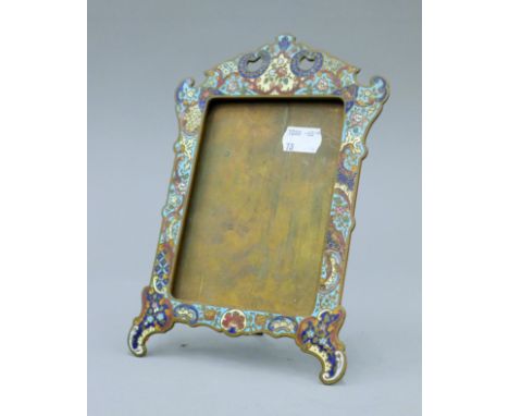 A 19th century brass and champleve enamel photograph frame. 22 cm high.