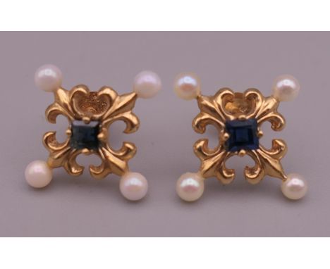 A pair of 14 K Faberge for Franklin Mint sapphire and seed pearl earrings. 1.2 cm wide. 