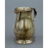 A silver cream jug. 8.5 cm high. 124.2 grammes.
