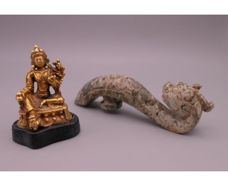 A jade dragon belt hook and a small gilt Buddha figure. The former 11 cm high.