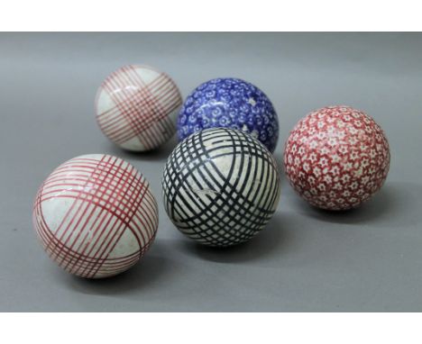 Five Victorian Scottish ceramic carpet bowls.