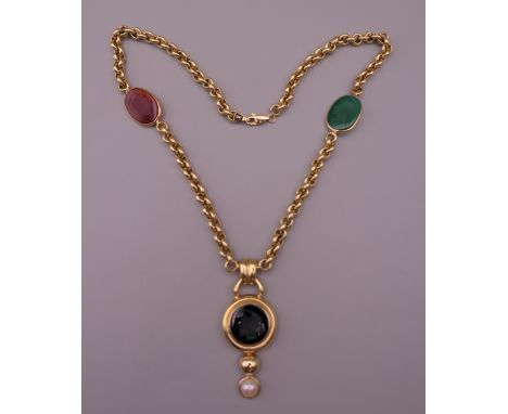 A 14 K gold intaglio set necklace. 41 cm long. 20.3 grammes total weight.