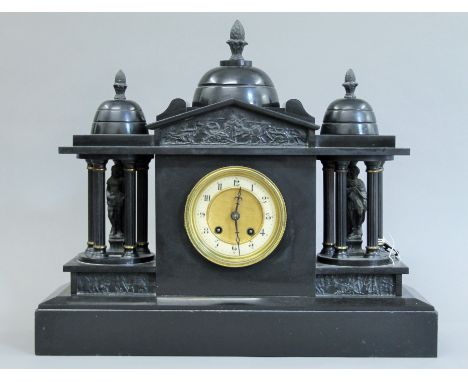 A Victorian black slate mantle clock. 48.5 cm wide.