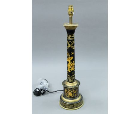 A black toleware column lamp. 61 cm high.