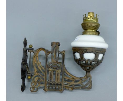 A Victorian wall mounted oil lamp. 