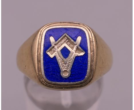 A 9 ct gold blue enamel Masonic signet ring. Ring size Q. 8.4 grammes total weight.