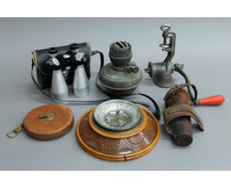 A barometer, a hunting flask, a model of elephants, etc.