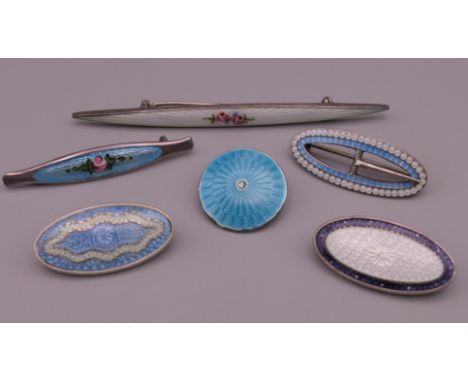 Six silver and enamel brooches. The largest 7.75 cm long. 