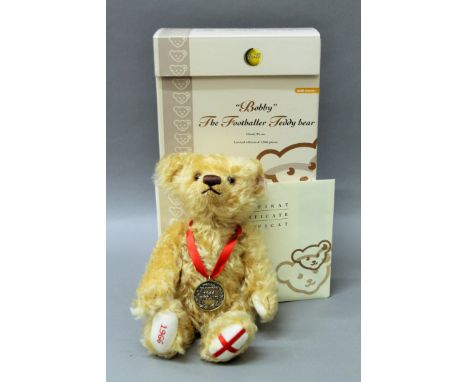 A boxed Steiff Bobby the Footballer teddy bear.