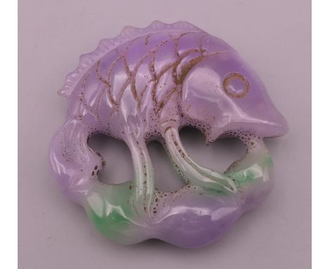 A lilac jade fish carving. 5.5 cm high.