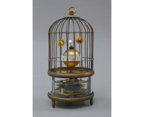 A bird cage clock. 19 cm high.
