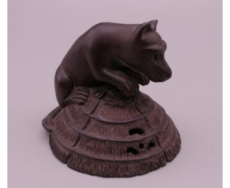 A netsuke formed as a dog. 4 cm high.